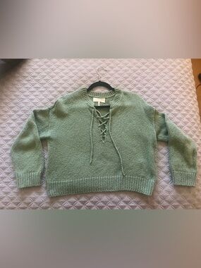 THE GREAT. Lace-Up Crewneck Sweater in Sage Green